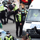 Image for article titled Hero Protestor Laid Under Immigration Van For Eight Hours To Stop Raid